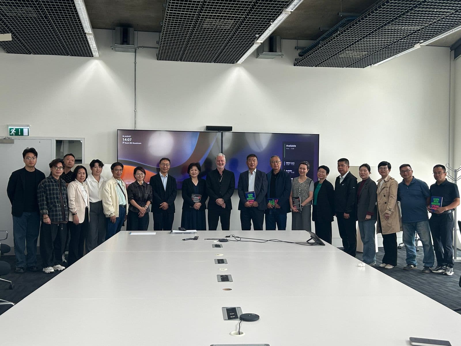Members of the Guangzhou Huashang College delegation in a meeting room during their 2025 UK visit